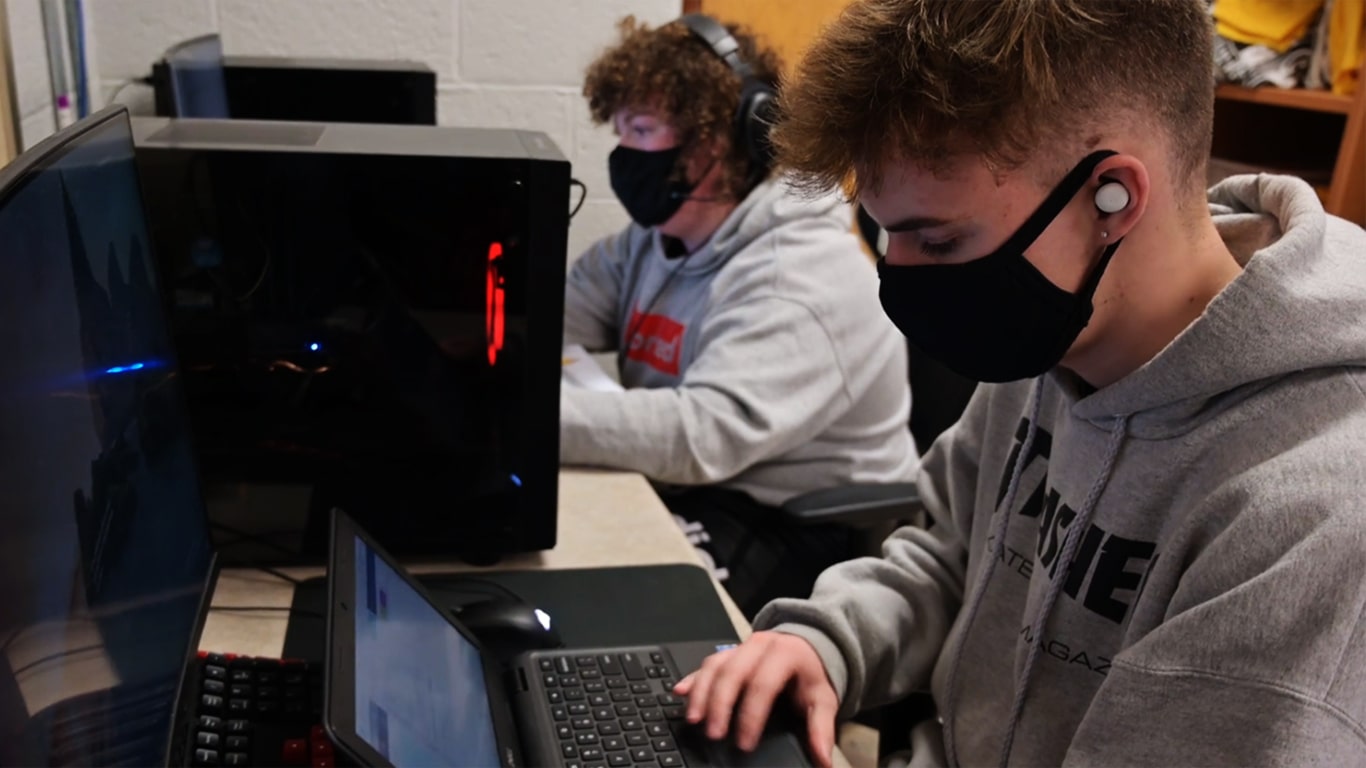 2 students complete a Code.org activity in their school computer lab.