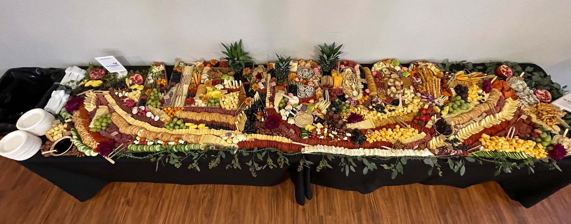 A spread of meat, cheese, vegetables, and crackers prepared by The Hangry Lady