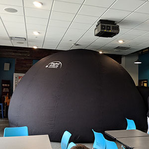 The StarLab portable planetarium inflated in the CoderDojo space.